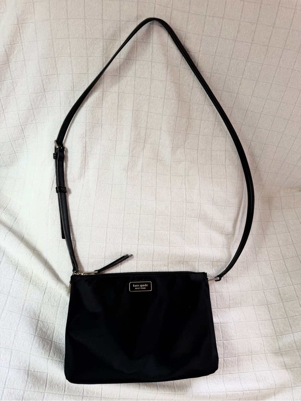 Kate Spade New York black nylon crossbody with gold accents